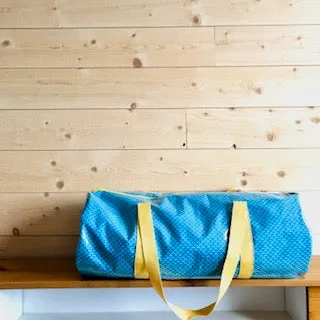 PIOLOU Le Sac Sac polochon bleu et jaune imperméable