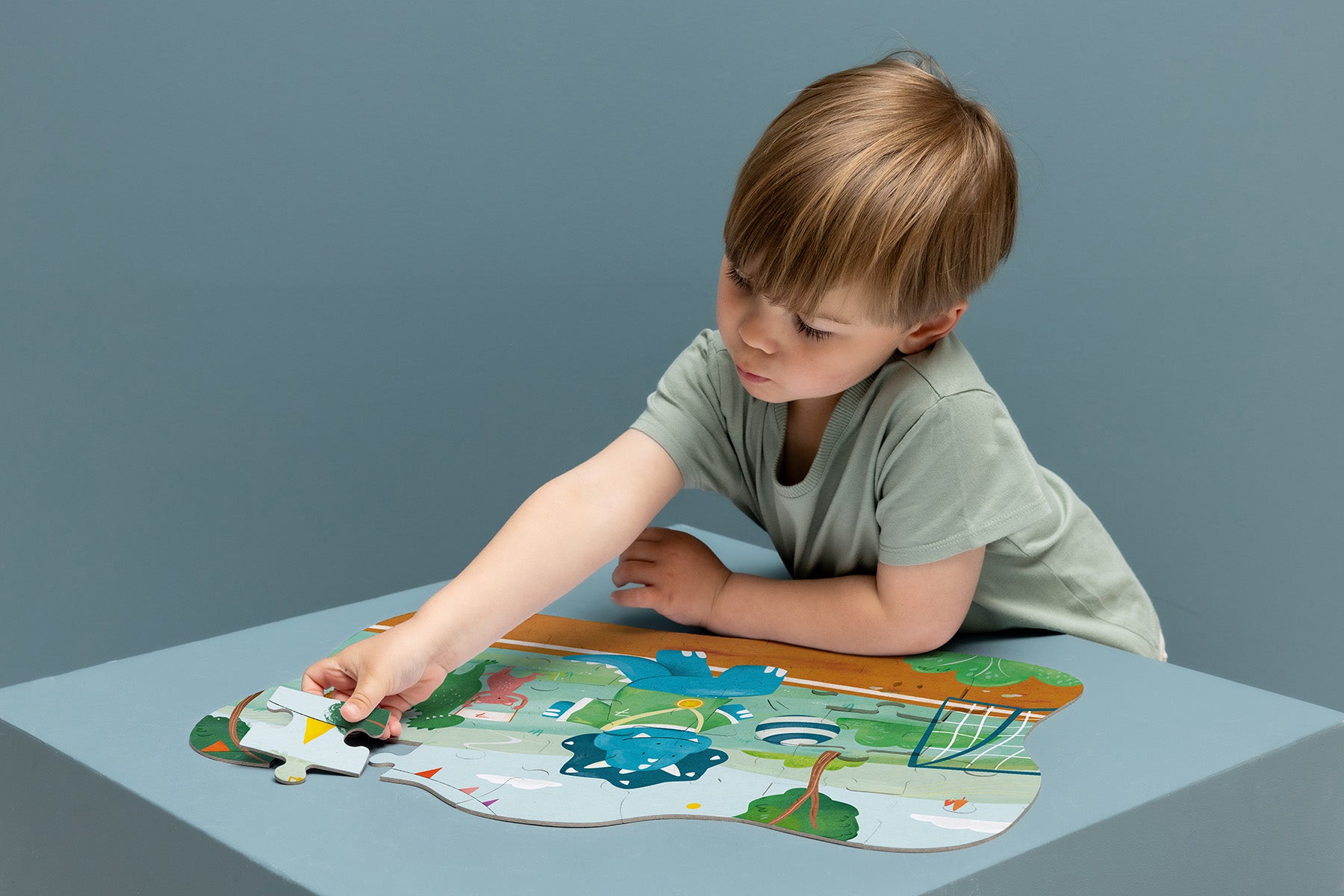 Trixie Baby Jeux, puzzles & livres Footballeur Mr. Triceratops puzzle à forme 35 pièces