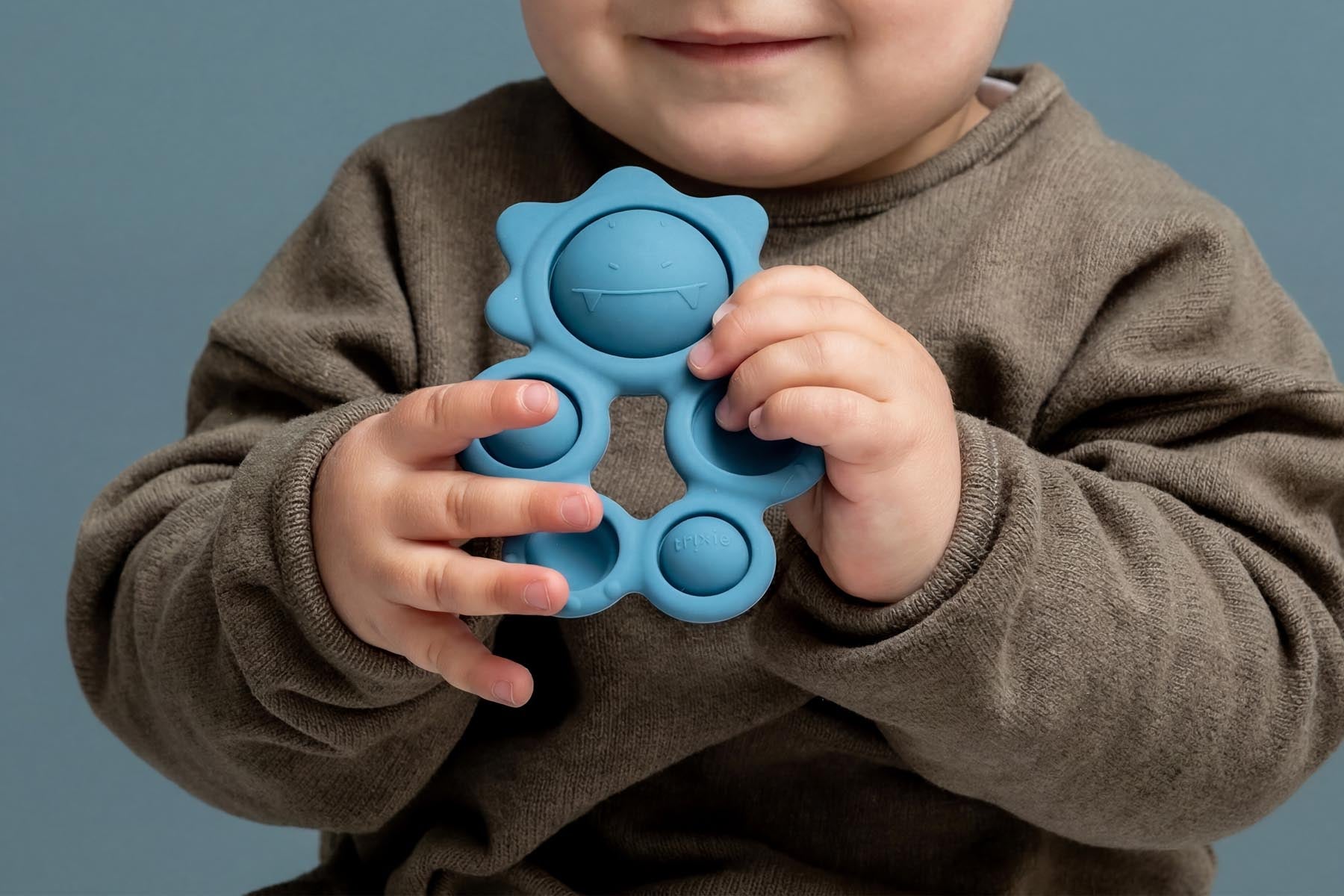 Trixie Baby Jouets sensoriels Mr. Triceratops pop-it en silicone